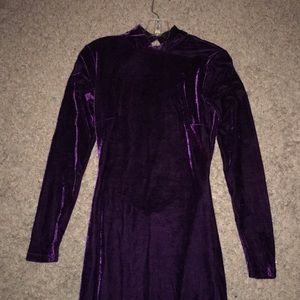 Long purple, velvet, and backless formal dress.